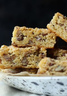 several pieces of cake sitting in a white bowl