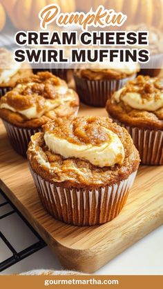 pumpkin cream cheese swirl muffins on a wooden cutting board with text overlay