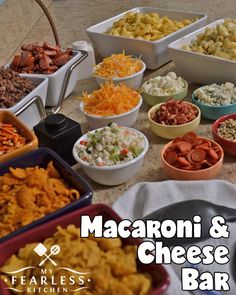 macaroni and cheese bar with different types of food in bowls on the table