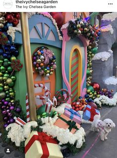 the entrance to mickey's christmas wonderland is decorated with colorful decorations and presents for sale