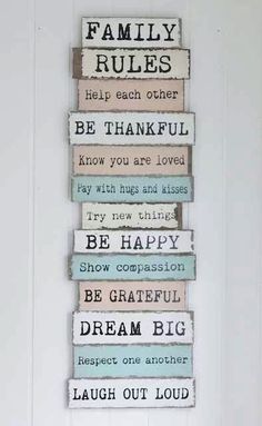 a family rules sign hanging on the wall