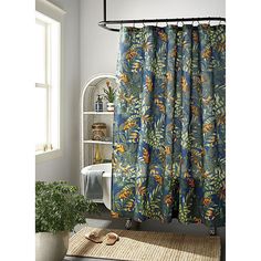 a bathroom with a shower curtain and rug