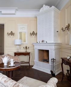 a living room filled with furniture and a fire place