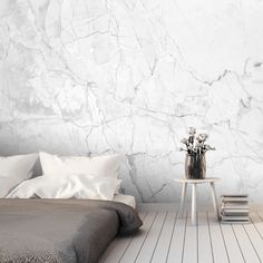 a bedroom with white marble walls and flooring