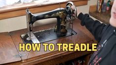 a young boy is using an old sewing machine to learn how to use the needle