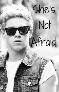 a young man wearing sunglasses with the words she's not afraid in front of him