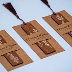 three wooden tags with floral designs on them