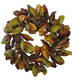 a wreath made out of leaves and acorns