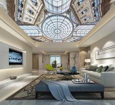 a living room filled with lots of furniture and a skylight above the couches