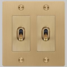 an image of two light switches on the same color as they appear in this photo