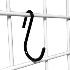 a black and white photo of an umbrella hook on a metal fence with no background