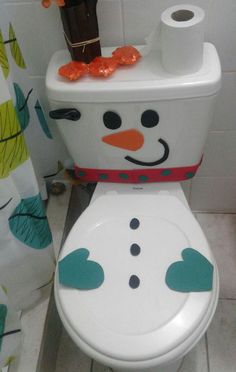 a toilet with a snowman painted on it