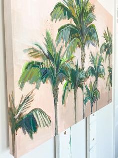 three palm trees are painted on a wall