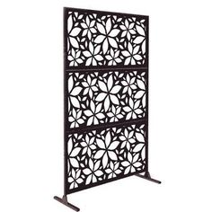 an intricately designed metal screen with four sections