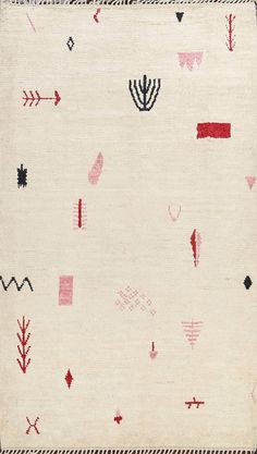 a white rug with red and black designs on it