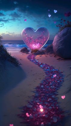 a path leading to a heart - shaped light in the sand with hearts on it