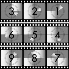 the numbers are placed on top of each other in front of a film strip with black and white stripes