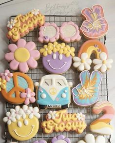 decorated cookies are sitting on a cooling rack