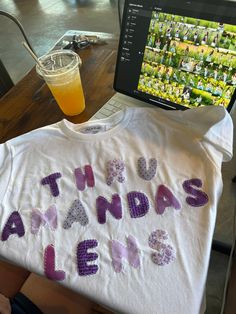 a t - shirt with the words that reads, this is my grandma's life on it next to a glass of orange juice