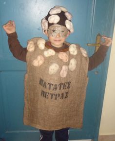 a young boy wearing a costume made out of burlocks and cotton balls