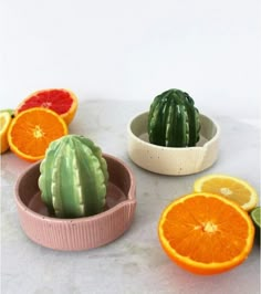 small bowls filled with fruits and vegetables on top of a white countertop next to each other