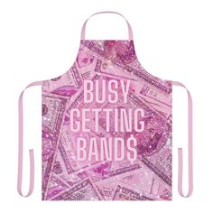 a pink apron with the words busy getting bands printed on it and lots of money