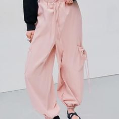 Size Medium. Color Is Soft Pink. Never Worn. 100% Polyester. #Pants #Cargopants #Summer Baggy Pink Summer Cargo Pants, Baggy Pink Cargo Pants For Summer, Trendy Baggy Cargo Pants For Spring, Summer Casual Cargo Pants, Trendy High-waisted Cargo Pants For Spring, Spring Baggy Solid Parachute Pants, Solid Color Parachute Pants With Cargo Pockets For Spring, Spring Solid Parachute Pants With Cargo Pockets, Casual Summer Parachute Pants With Cargo Pockets