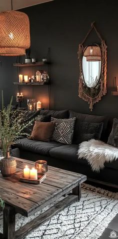 a living room filled with lots of furniture and candles on top of it's coffee table