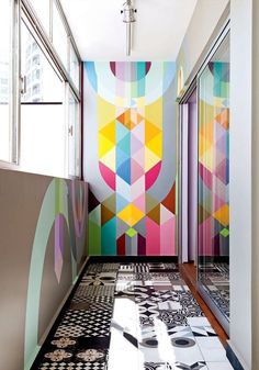 the hallway is decorated with colorful geometric designs