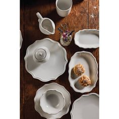 white dishes and cups on a wooden table