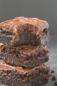 three chocolate brownies stacked on top of each other