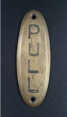 an old metal object with the word fuel on it's side and two holes in the middle