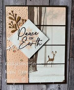 a close up of a card on a wooden surface with the words peace on earth