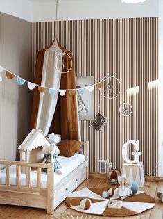 a child's bedroom decorated in brown and white