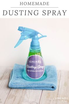 a bottle of homemade dustin spray sitting on top of a blue towel