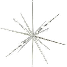 a metal star ornament on a white background