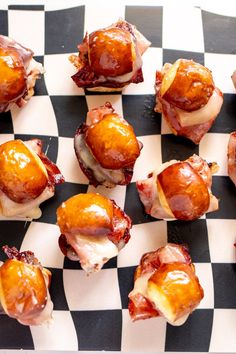 small pastries are arranged on a checkered tablecloth