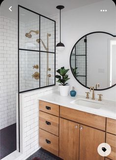 a bathroom with two sinks and a large mirror