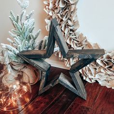 a wooden star next to a christmas tree