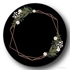 a black plate with white flowers and greenery on it