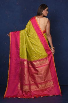 Look elegant on special occasions in this beautiful pista green Gadhwal silk saree with pink border and pallu. It has scattered zari buta and comes with a matching blouse piece. Shop silk sarees in USA from Pure Elegance. The shown stitched blouse on the model is for display purpose only. The saree comes with a matching blouse piece and finished with fall and piko. Pista Green, Chiffon Sarees, Pink Border, Fashion Goals, Pure Elegance, Fashion Journals, Kanjivaram Sarees, Traditional Fabric, Silk Sarees Online