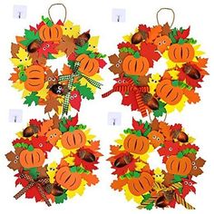 the wreaths are decorated with fall leaves and pumpkins