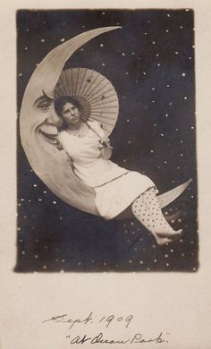 an old black and white photo of a woman on the moon with an umbrella over her head