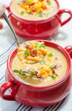 a red bowl filled with soup on top of a table