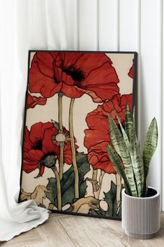 a painting with red flowers on it next to a potted plant in front of a curtain