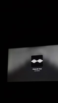 the sound board is lit up in the dark, and it has white waves on it