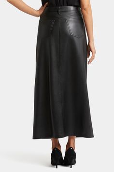 Ultra sleek and curve sculpting, NYDJ's Vegan Stretch Leather High Rise Long Skirt is a classic wardrobe staple that you'll get endless wears out of all season long. Made from a premium lightweight compression vegan leather with comfortable stretch, this full-length skirt features five-pocket styling, a zip fly with button closure and a center front slit for ease of movement. Our signature Lift Tuck® Technology provides just the right amount of support for a smooth, flawless figure—all thanks to Skirt Styling, Full Length Skirts, Classic Wardrobe Staples, Classic Wardrobe, Faux Leather Skirt, Petite Outfits, Bottom Clothes, Black Faux Leather, Skirt Fashion