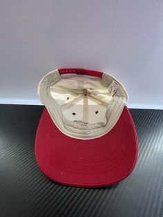 Very Good - Excellent quality. May have very minor imperfections that may or not be visible to the eye. Minor use. This vintage cap features the iconic T-Rex from Universal Studios Parks. With a red bill and white cap, it adds a touch of nostalgia to any outfit. Show your love for the parks with this unique and stylish accessory. FEATURES Classic Red Snapback Baseball Cap, Classic Red Snapback Cap, Classic Red Snapback Hat With Curved Brim, Classic Red Trucker Hat, Classic Red Baseball Cap With Visor, Classic Red Visor Baseball Cap, Classic Red Baseball Cap With Curved Brim, Classic Red Dad Hat With Curved Brim, Vintage Red Cotton Hat