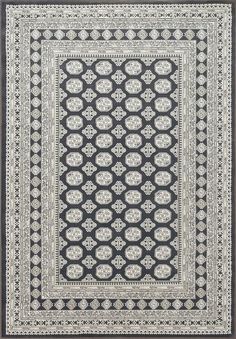 a black and white rug with an intricate design on the center, surrounded by smaller circles