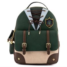 a green backpack with brown straps and a crest on the front, sitting against a white background